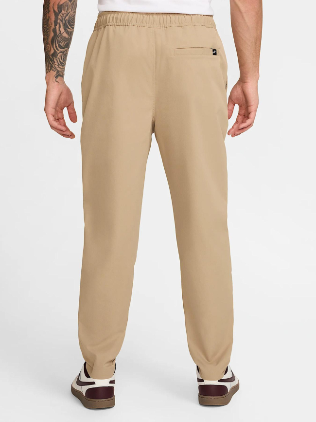 Pantalon tissé fuselé club beige homme - Nike