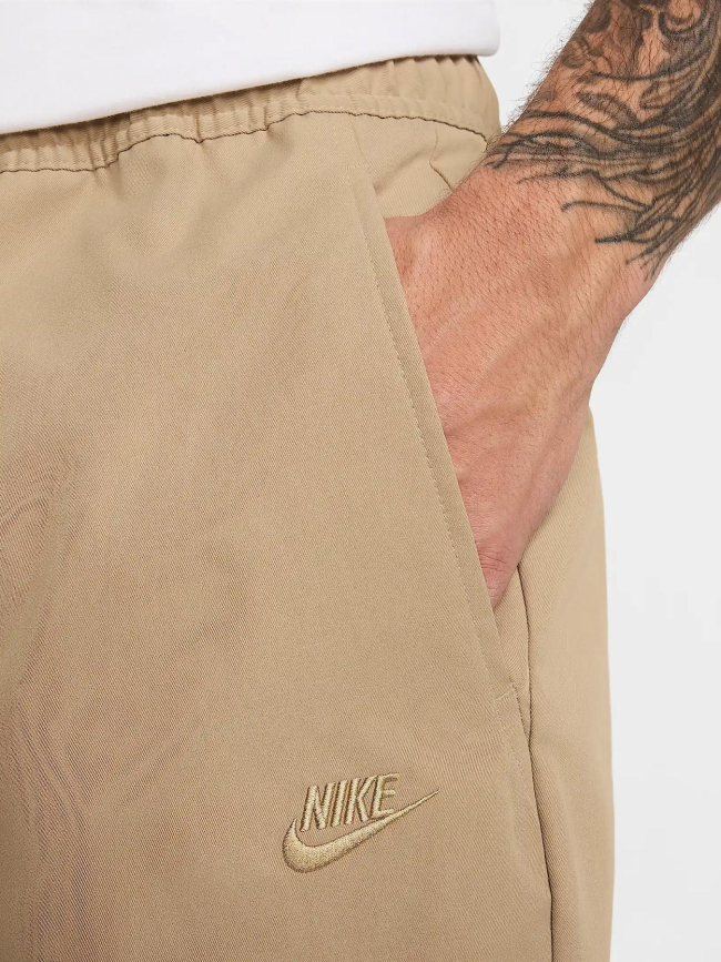 Pantalon tissé fuselé club beige homme - Nike